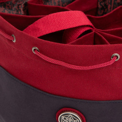 Two-tone red and dark grey Critical Role dice bag with drawstring closure and internal dividers