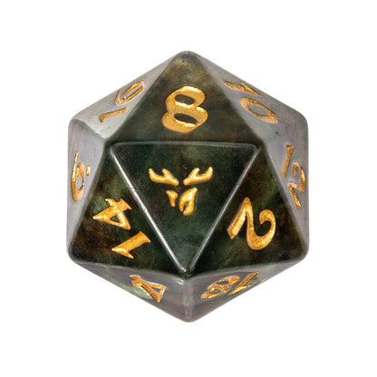 A marbled dark green and bronze D20 with gold numbers and a stag head symbol on one face