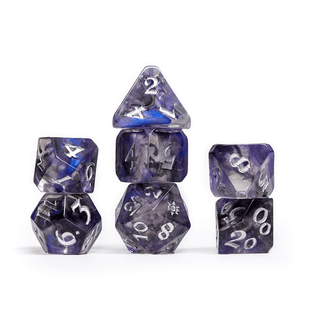 Seven translucent blue and clear swirled polyhedral dice, stacked in columns