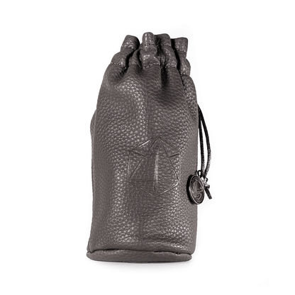 Dark grey pebbled leather drawstring pouch with an embossed geometric symbol and a small charm
