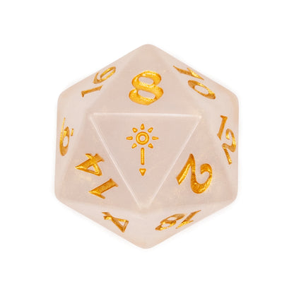 A translucent pearl D20 with gold numbers and a stylized sun symbol on the '1' face