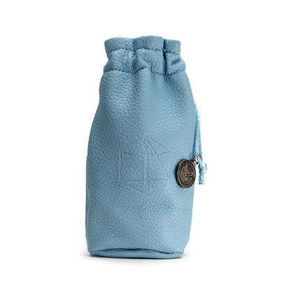 A light blue pebbled leather drawstring dice bag, embossed with a D20 sword symbol and an L charm