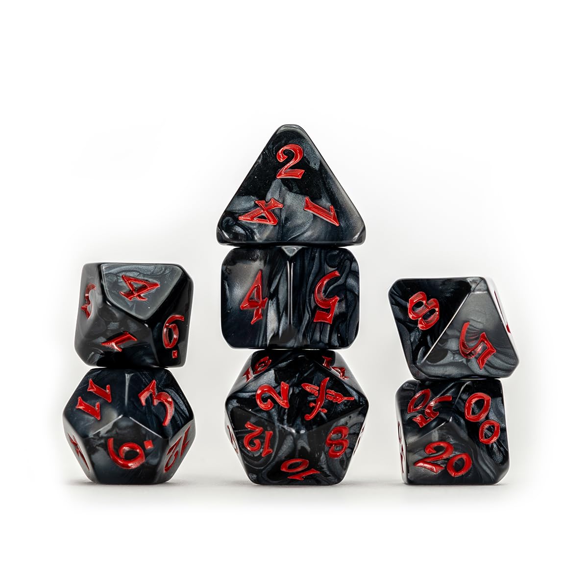 Seven black marbled dice with bold red numbers, arranged in stacks on a white background