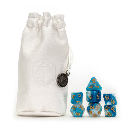 White pebbled dice pouch with sword symbol & charm, next to a set of swirled blue, white, and gold polyhedral dice