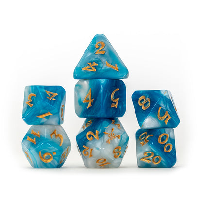 Seven blue and white swirled polyhedral dice with gold numbers, creatively stacked