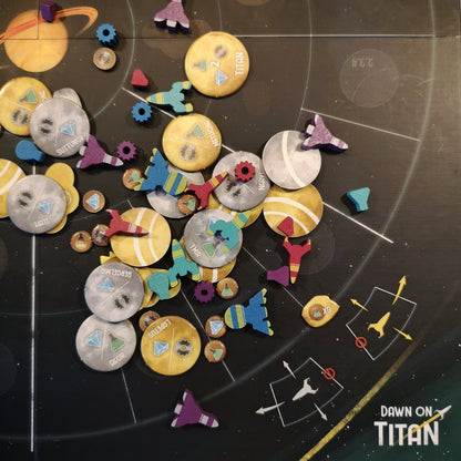 Detailed view of game components from Dawn on Titan including cards, tokens, tiles, and ships arranged on a table