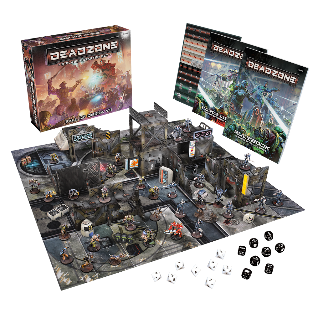 A Deadzone sci-fi wargame setup: box, rulebooks, modular terrain, many miniatures, and dice on a battle mat
