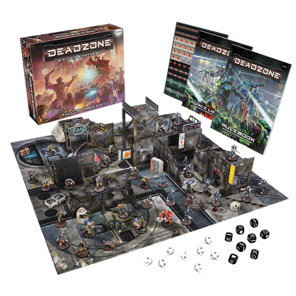 A Deadzone sci-fi wargame setup: box, rulebooks, modular terrain, many miniatures, and dice on a battle mat