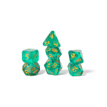Three stacks of translucent green polyhedral dice with gold numbers