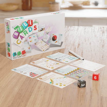 ICE CARDS educational game: box, cards, marker, and dice arranged on a wooden table