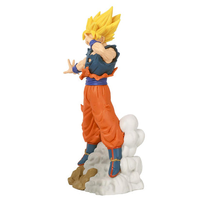 Super Saiyan Goku figure in orange gi and torn blue shirt, standing on cloud base, hands open for energy attack