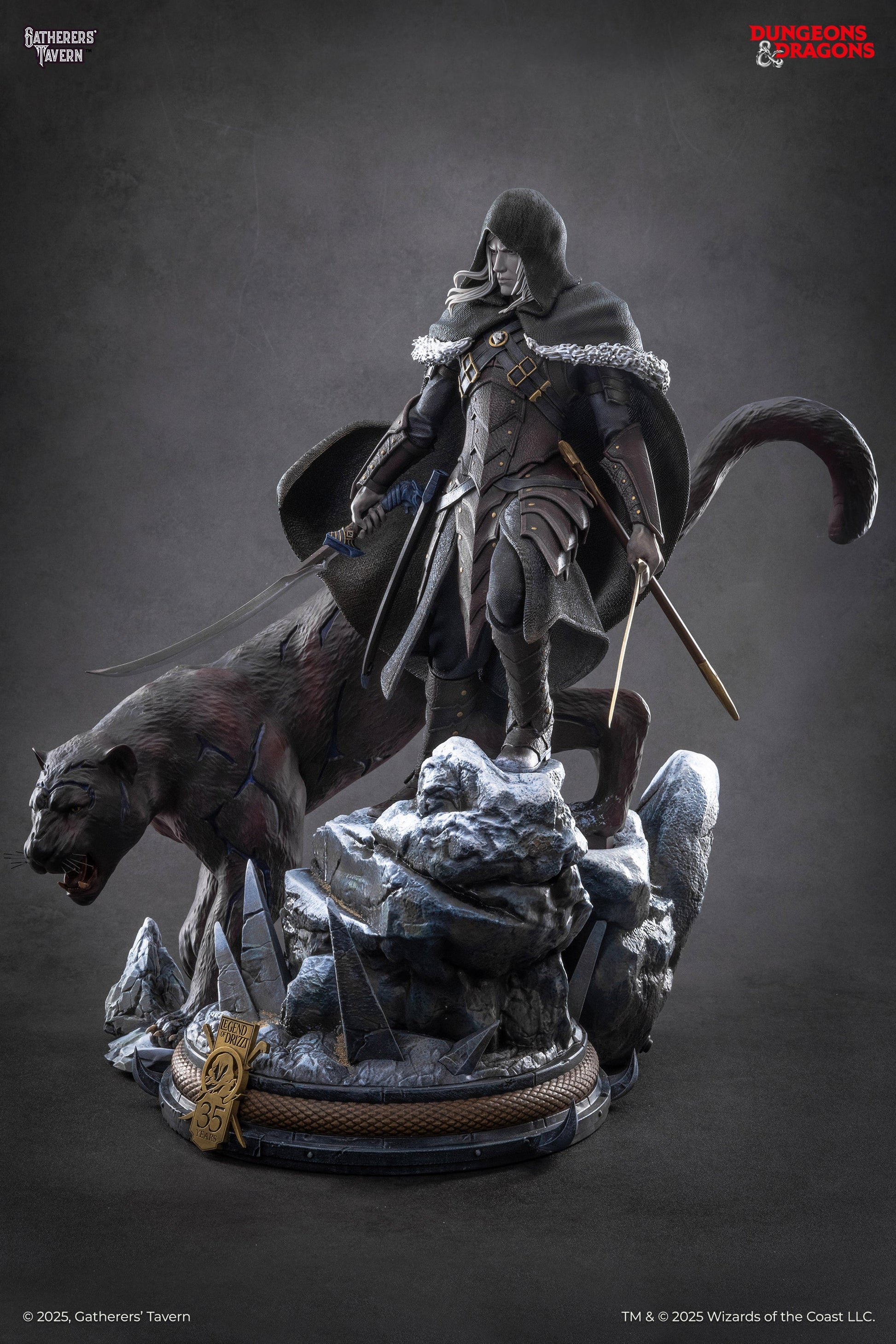 A fantasy statue of Drizzt Do'Urden, a hooded figure with white hair and two swords, standing on snowy rocks beside a black panther with an open mouth