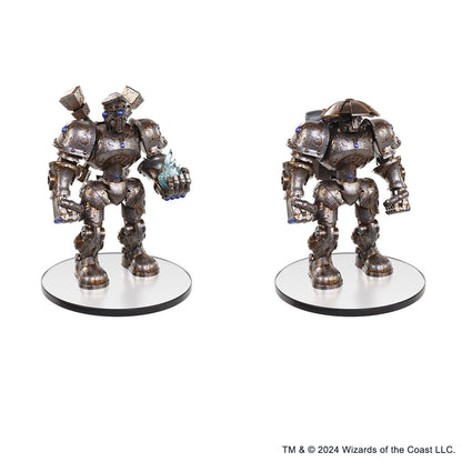 Two dark bronze steampunk robot miniatures with blue gems, one holds blue energy with shoulder cannons, the other has a domed head