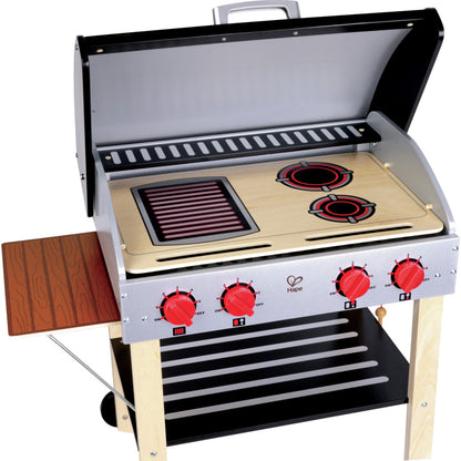 Hape wooden toy grill with side shelf, stovetop burners, and BBQ grate