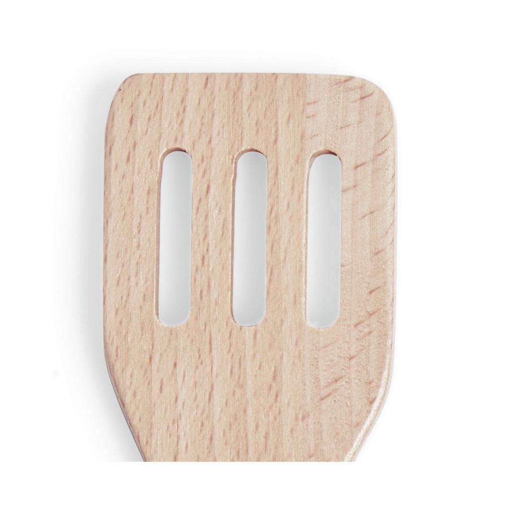 Close-up of a slotted wooden spatula head with three vertical cutouts, centered on a white background