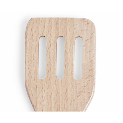 Close-up of a slotted wooden spatula head with three vertical cutouts, centered on a white background