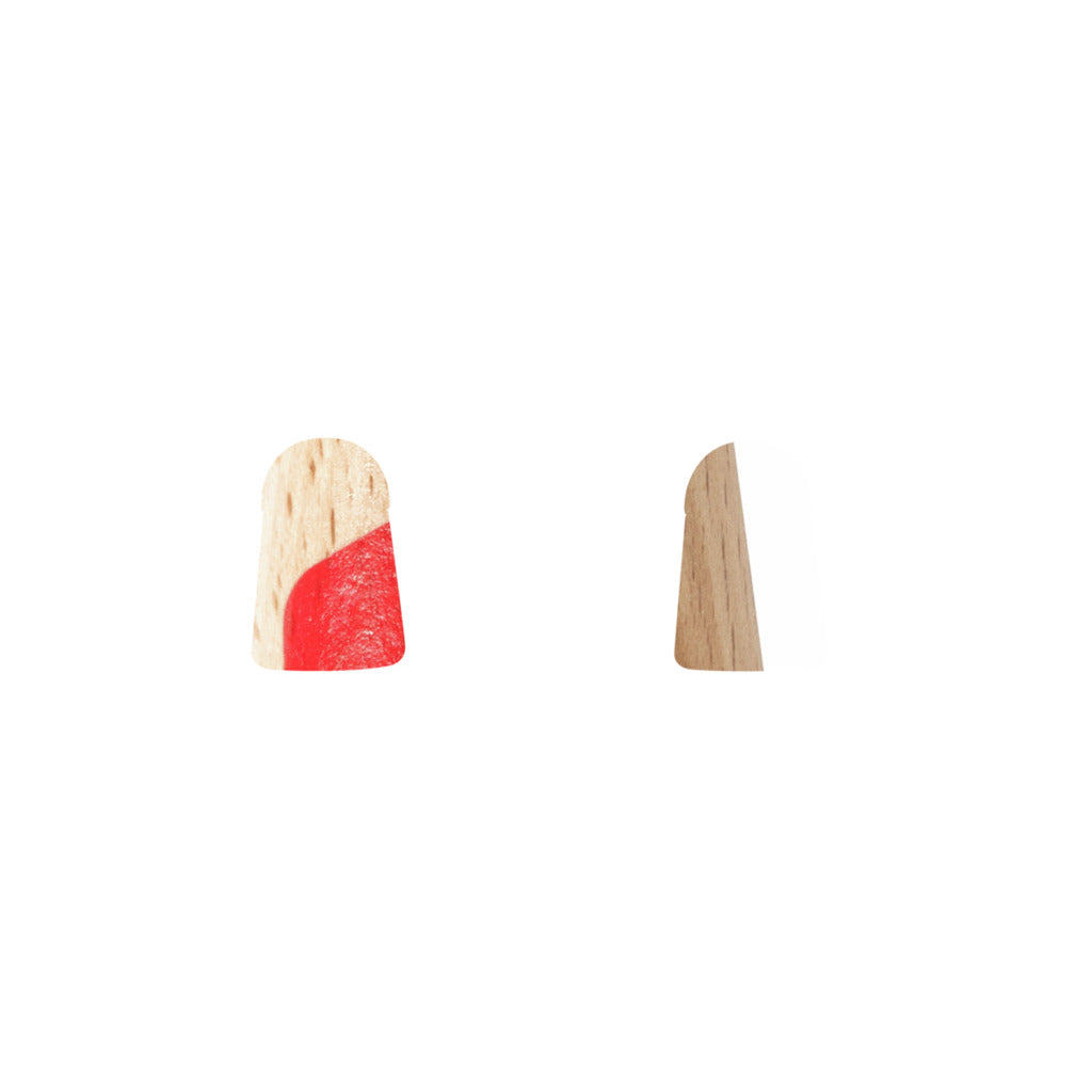 Rounded wooden dowel plug, partially covered in bright red paint, shown next to a wood grain profile view