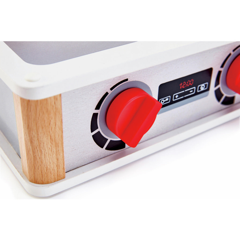 Wooden toy kitchen stovetop with red plastic knob, digital display showing "12:00," and faux brushed metal finish