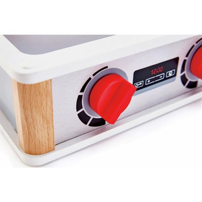 Wooden toy kitchen stovetop with red plastic knob, digital display showing "12:00," and faux brushed metal finish