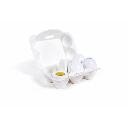 Toy egg carton holding white eggs, one split open to show a yellow yolk