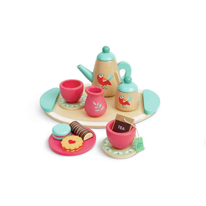 Wooden toy tea set with teapot, cups, saucers, and play cookies on a serving tray