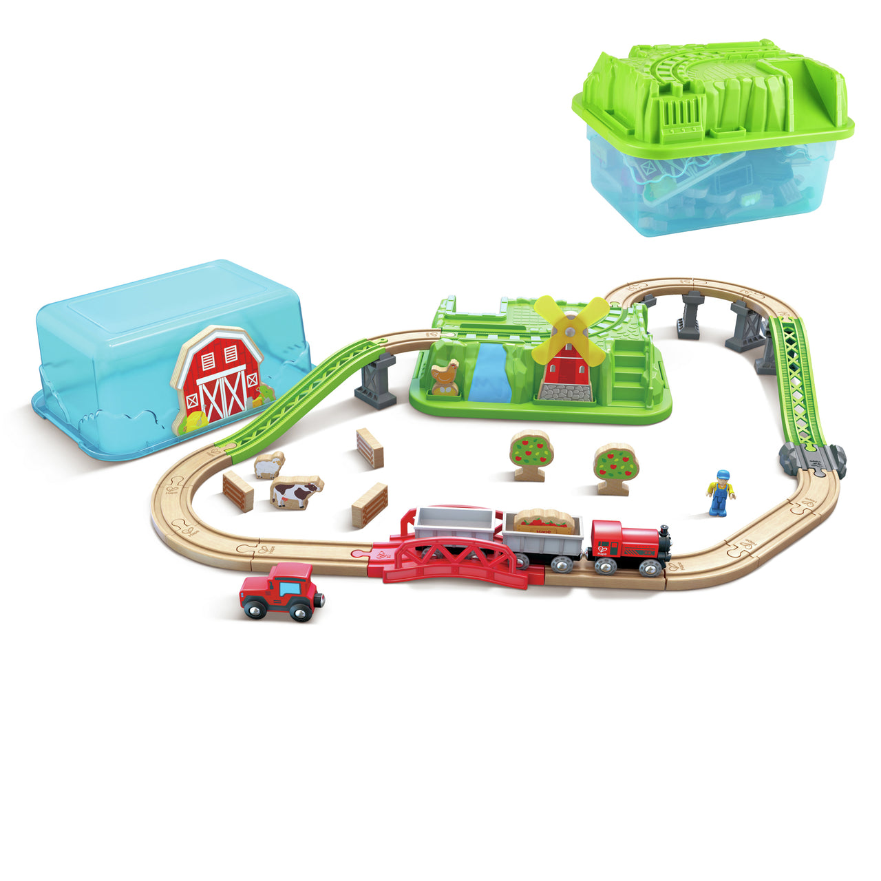 Farm-themed wooden train set layout with tracks, red engine, bridge, figures, and two storage containers