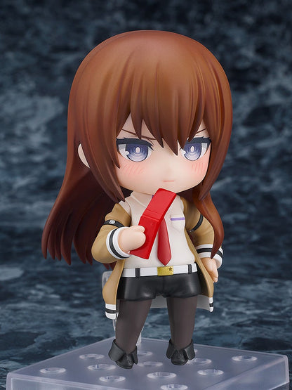 Nendoroid 135 Kurisu Makise figure in tan coat and red tie holding red flip phone