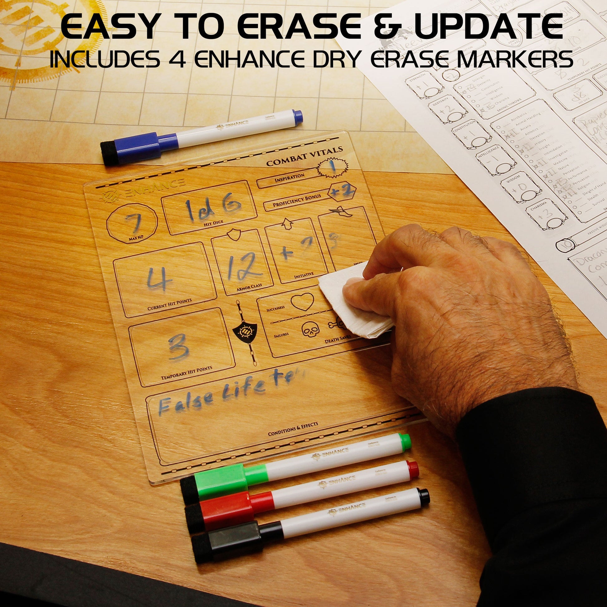 A hand erases numbers from a clear acrylic dry-erase D&D combat vital board with a cloth 