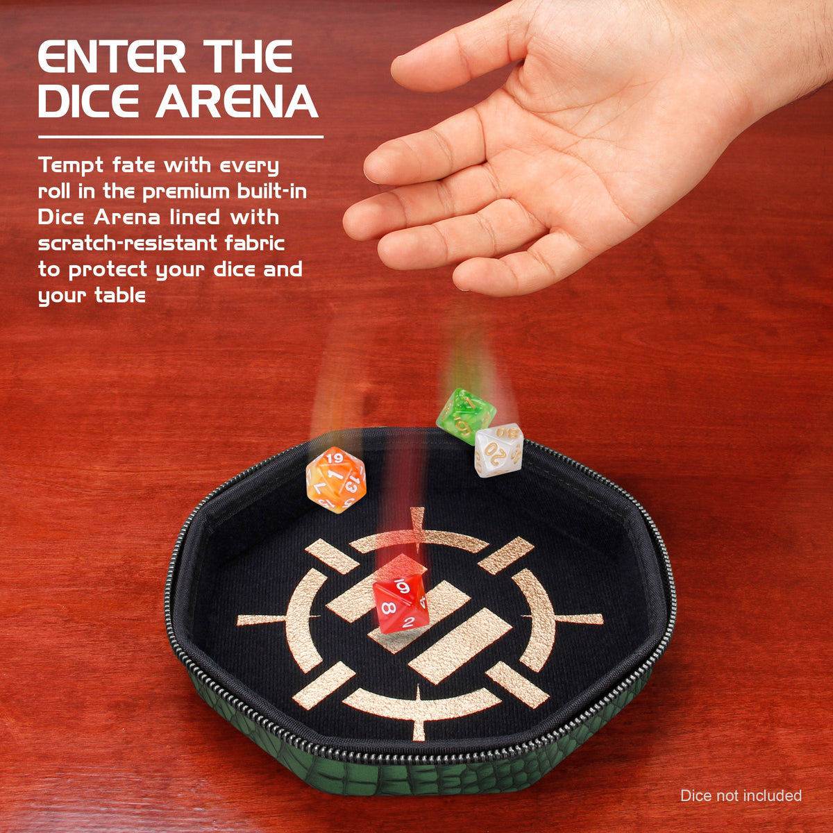 A hand drops multi-colored polyhedral dice into a black, round dice tray with a gold design, on a wooden table