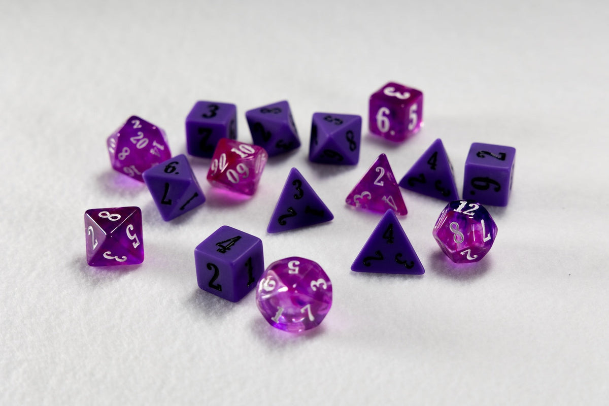 Various purple and pink gaming dice scattered on a white surface