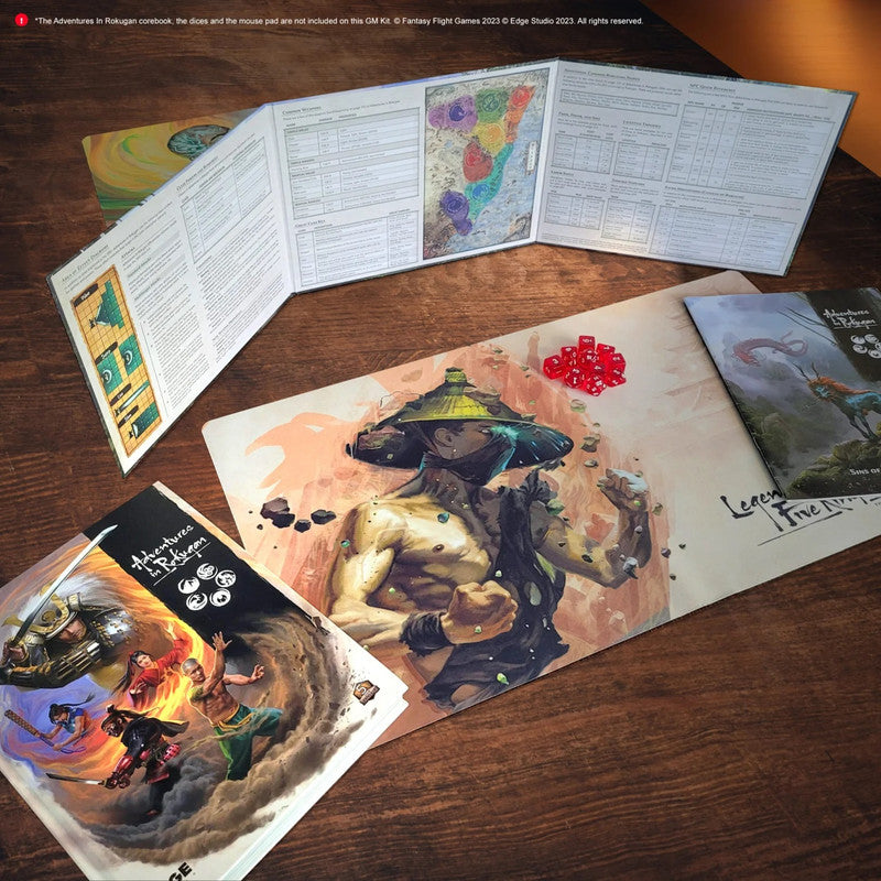 Legend of the Five Rings RPG: GM screen, martial artist playmat with red dice, and rulebooks laid on a wooden table
