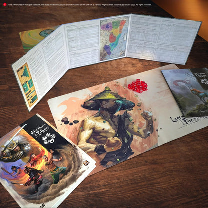 Legend of the Five Rings RPG: GM screen, martial artist playmat with red dice, and rulebooks laid on a wooden table