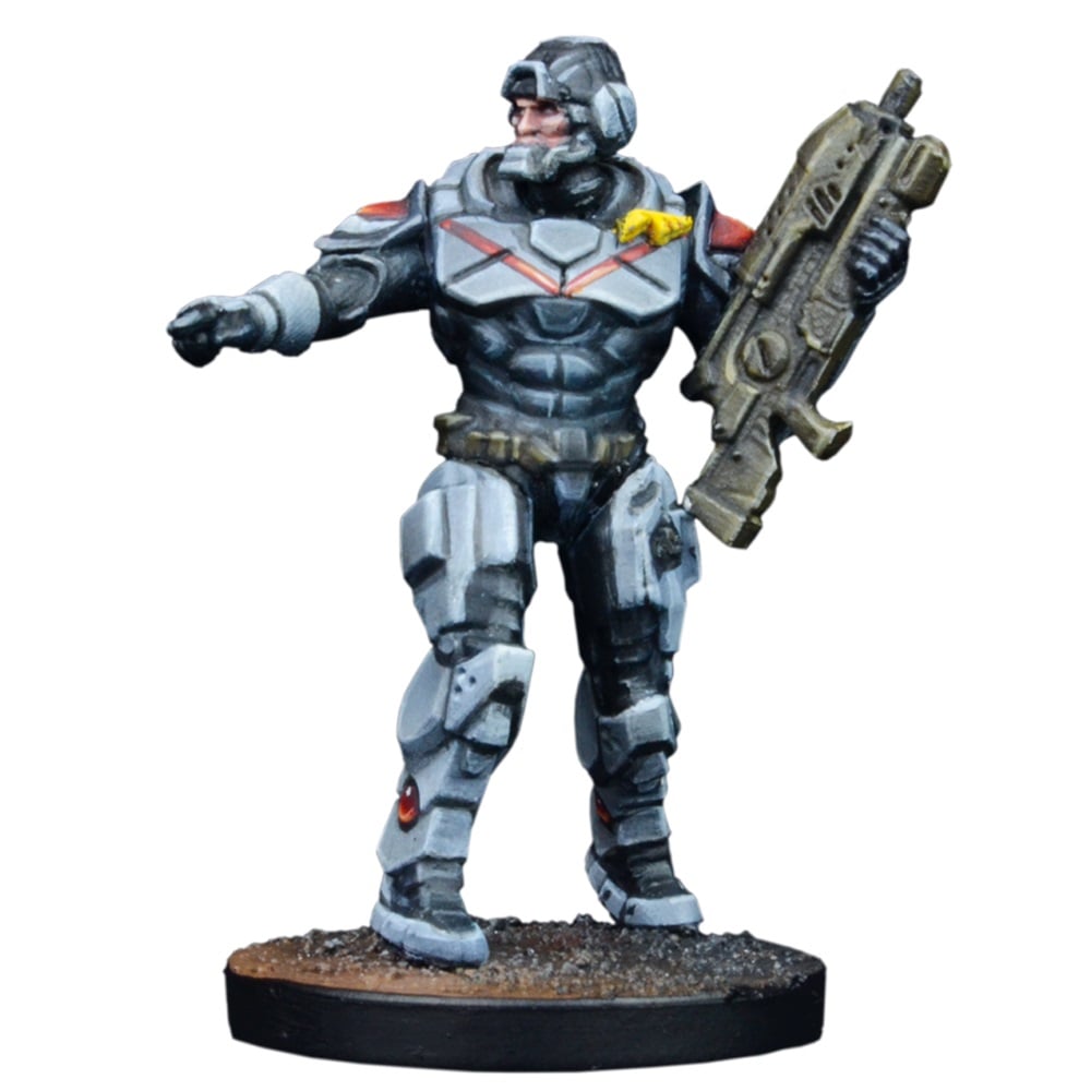 A detailed sci-fi miniature of an armored soldier in gray and black armor, holding a rifle and pointing.