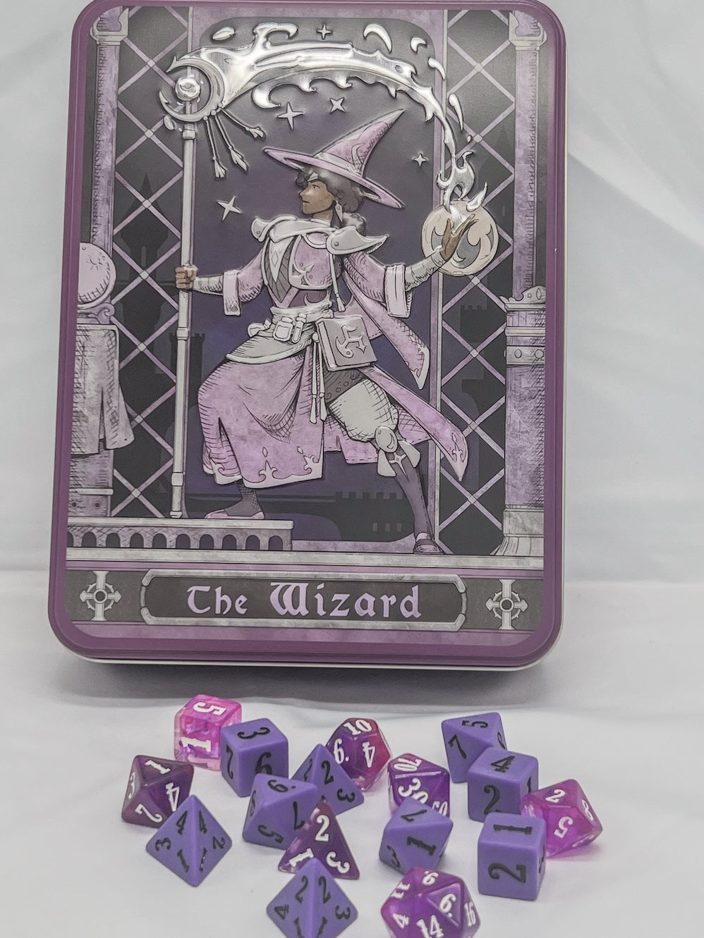 Purple tin box featuring a wizard holding a staff and glowing orb, with &quot;The Wizard&quot; text and scattered purple dice