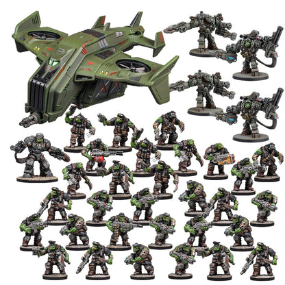 A collection of green sci-fi miniatures: a large dropship, four armored brutes and many armed orc-like soldiers