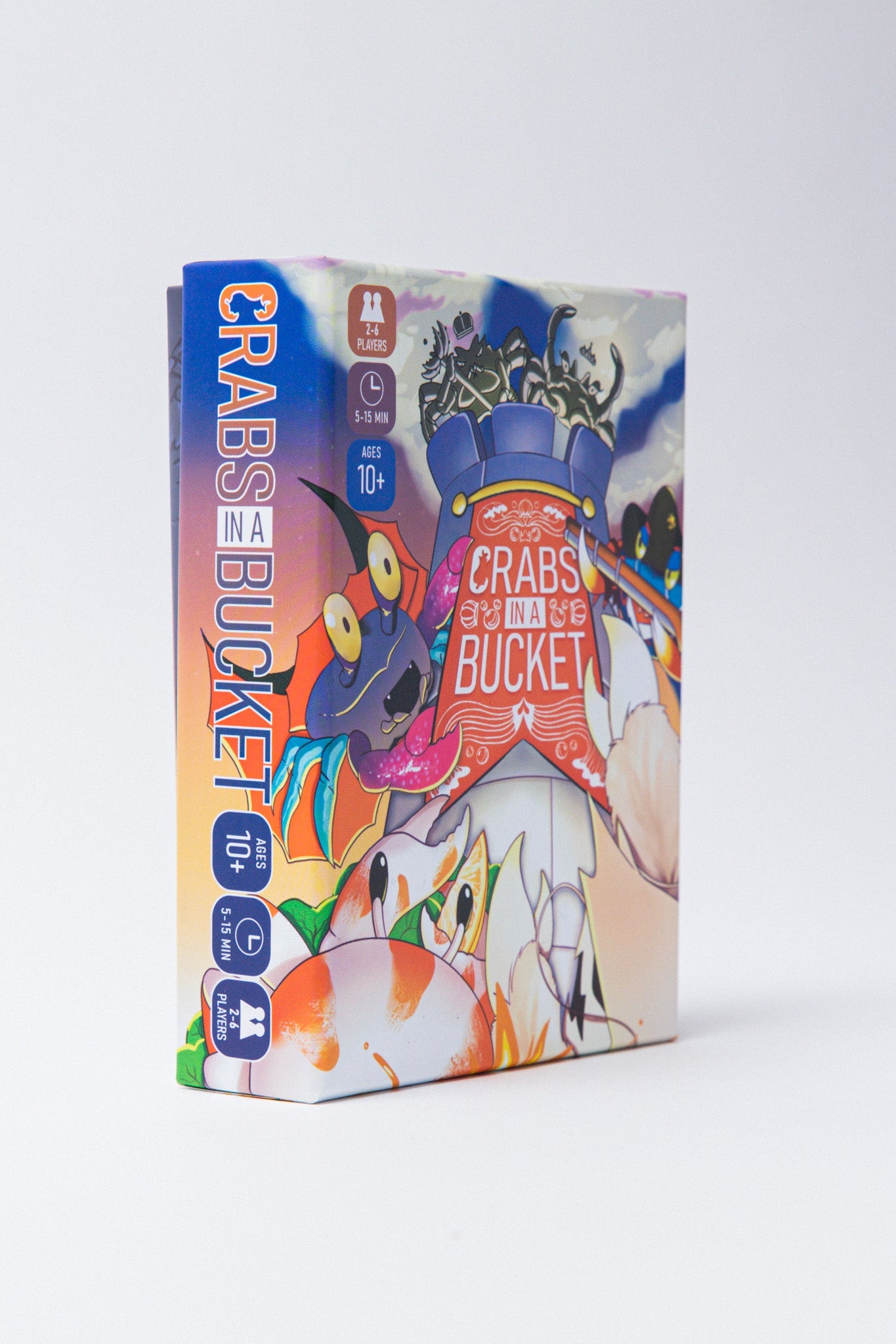 A game box for Crabs in a Bucket featuring colorful cartoon art of crabs climbing over each other
