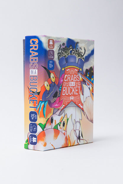 A game box for Crabs in a Bucket featuring colorful cartoon art of crabs climbing over each other