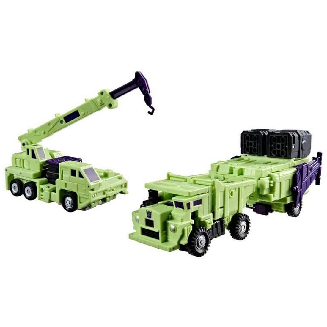 Two green and purple Transformer vehicle toys: a crane truck with boom extended and a missile transport