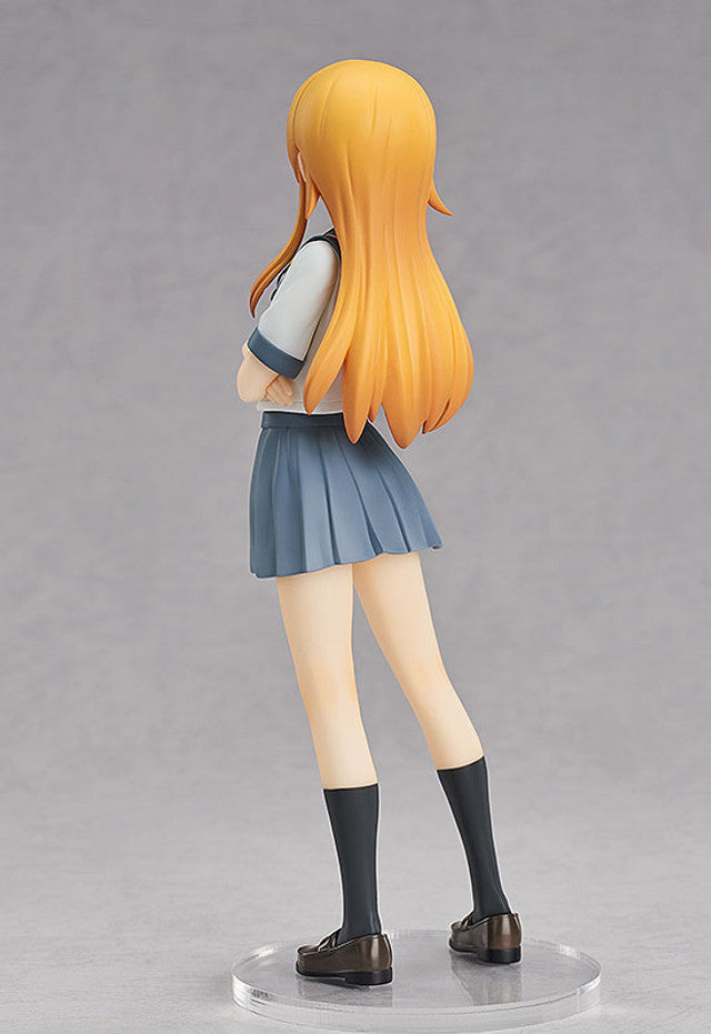 Side view highlighting the sculpted pleats of her skirt and hair movement
