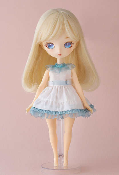 Side view of Curious doll with gentle expression and vibrant outfit textures