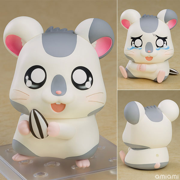 Nendoroid Oxnard posed holding a sunflower seed with a happy expression