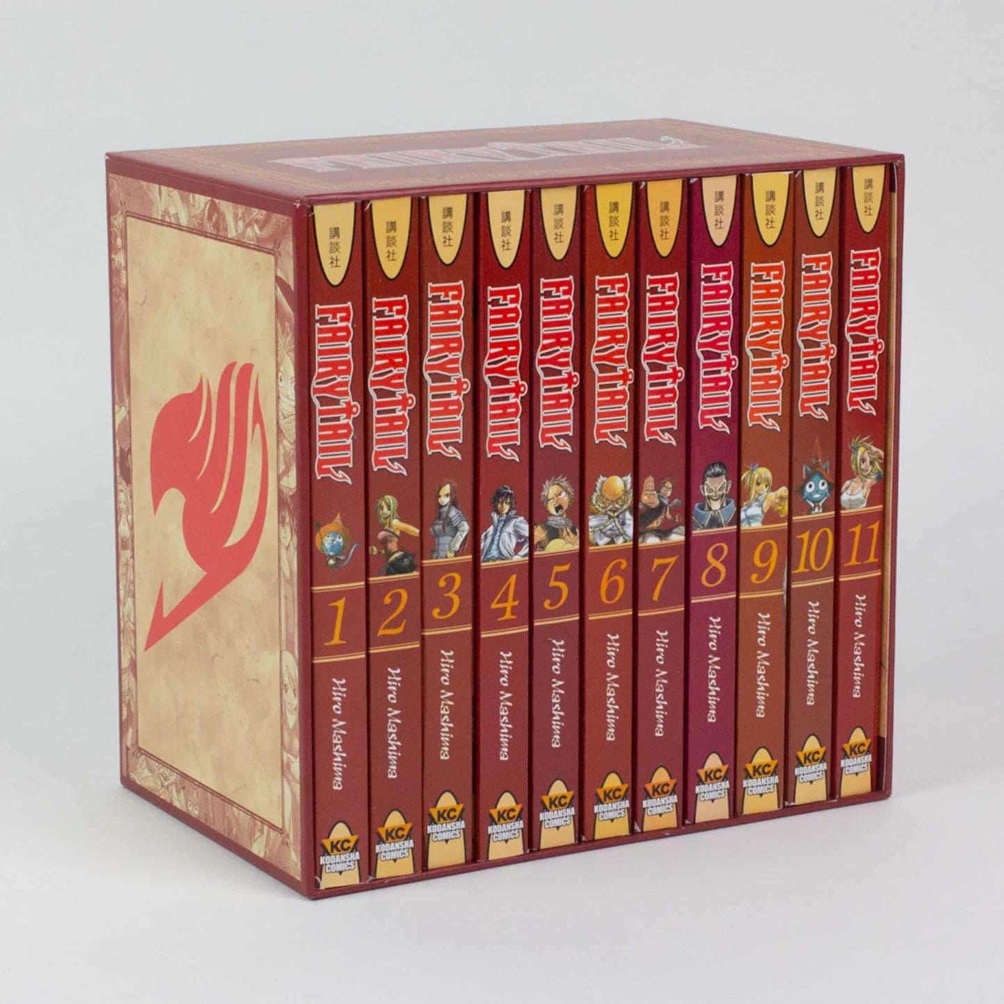 Fairy Tail manga box set displaying 11 volumes with character art and numbers on their spines.