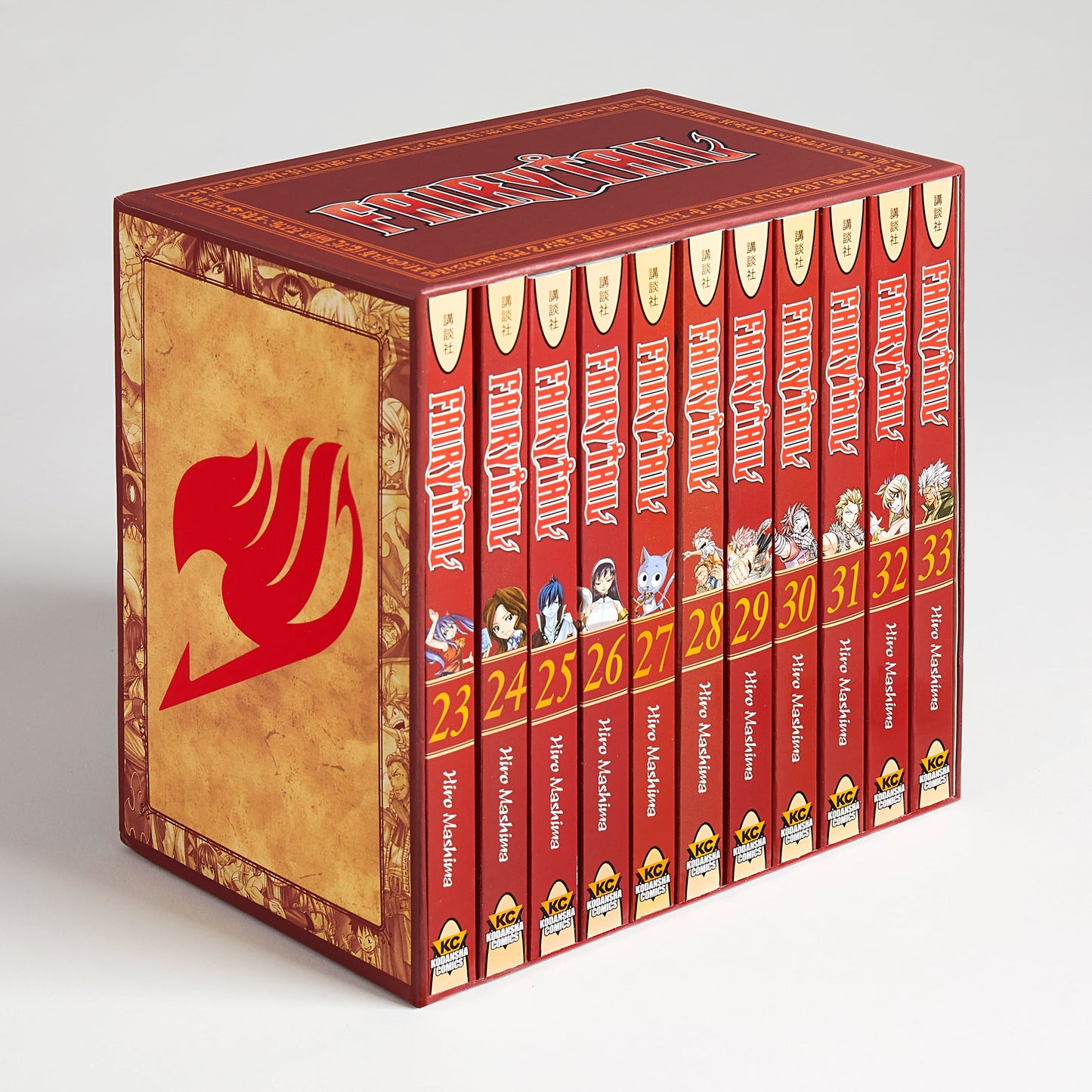 A red Fairy Tail manga box set with the guild mark, holding volumes 23-33. Spines show characters, titles, and numbers.
