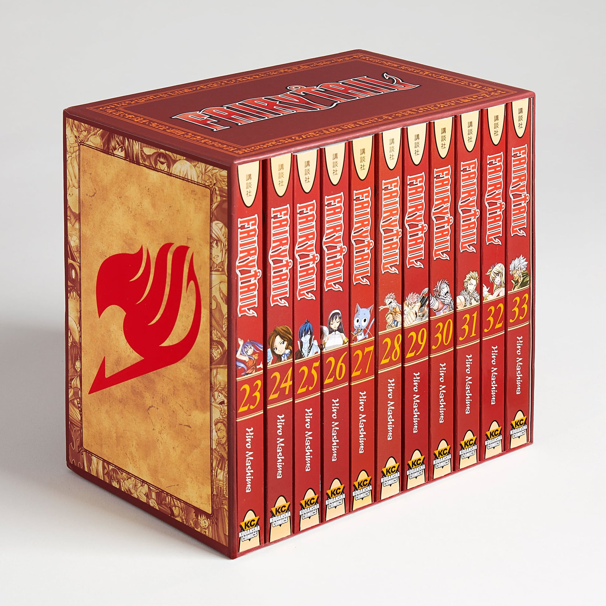 A red Fairy Tail manga box set with the guild mark, holding volumes 23-33. Spines show characters, titles, and numbers.