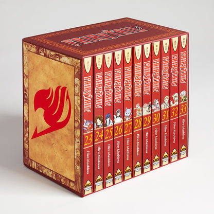 A red Fairy Tail manga box set with the guild mark, holding volumes 23-33. Spines show characters, titles, and numbers.