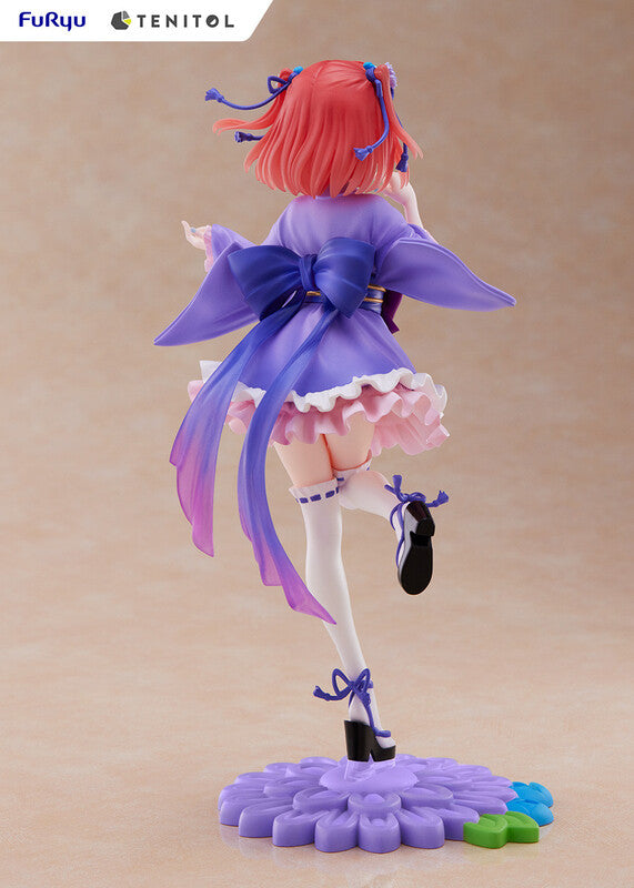 Side profile of Tenitol Nino figure showing flowing hair and outfit detail