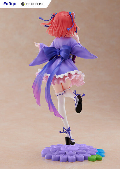 Side profile of Tenitol Nino figure showing flowing hair and outfit detail