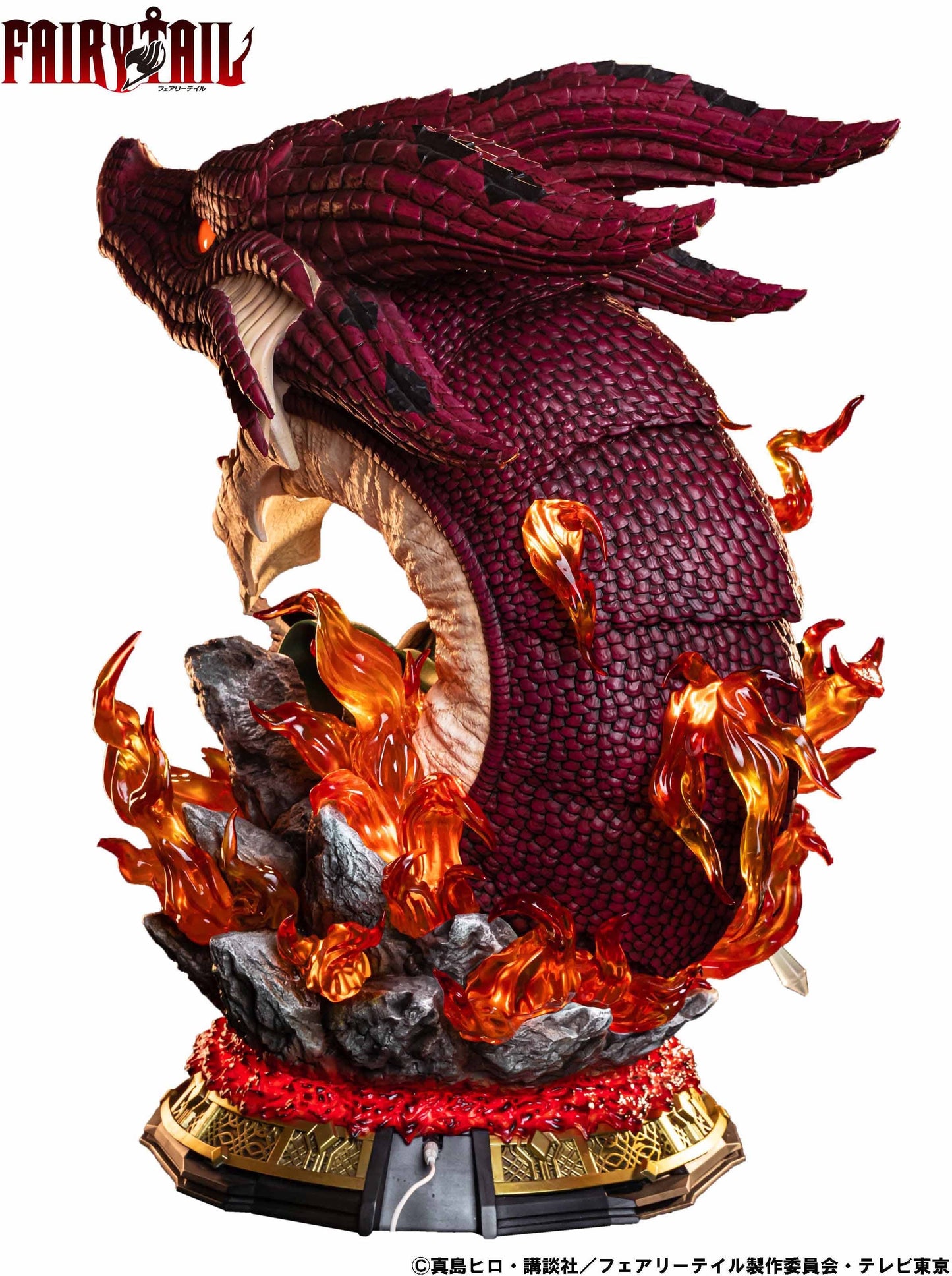 Statue of a roaring, crimson-scaled dragon head and neck with glowing eyes, surrounded by bright orange flames. Fairy Tail