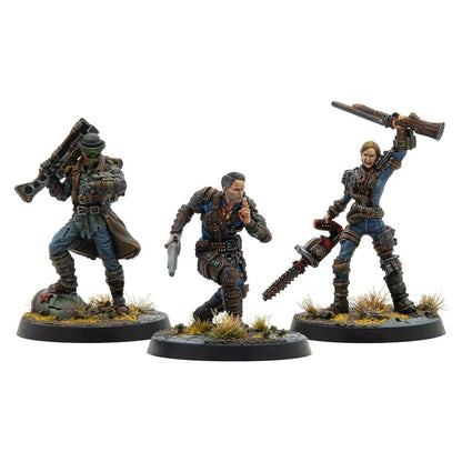 Three painted wasteland miniatures: a shotgun-wielding man, a man shushing with a pistol, and a woman with a rifle and chainsaw