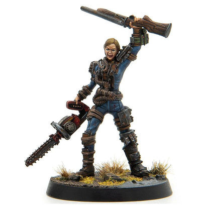 Fierce female miniature in blue jumpsuit with ammo belts, holding a chainsaw and raising a rifle